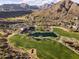 Aerial view of a community golf course and clubhouse at 15831 E Thistle Dr, Fountain Hills, AZ 85268