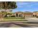 Single-story home with a two-car garage and landscaped front yard at 1570 W Bartlett Way, Chandler, AZ 85248