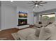 Living room with a cozy sectional sofa and a fireplace at 1570 W Bartlett Way, Chandler, AZ 85248