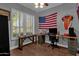 Home office with a large window and a rustic wooden desk at 1570 W Bartlett Way, Chandler, AZ 85248