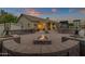 Relaxing backyard patio with fire pit and built-in seating at 1570 W Bartlett Way, Chandler, AZ 85248