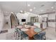 Open concept dining area with wood table and modern chairs at 1685 S Wallrade Ln, Gilbert, AZ 85295