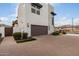 Attached garage with modern finishes and a brick driveway at 1685 S Wallrade Ln, Gilbert, AZ 85295