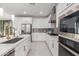 Modern kitchen with stainless steel appliances and white shaker cabinets at 1685 S Wallrade Ln, Gilbert, AZ 85295