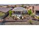 Single story home with backyard patio and desert landscaping at 17676 E Woolsey Way, Rio Verde, AZ 85263