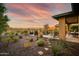 Desert landscape with patio furniture, fire pit, and mountain views at 17676 E Woolsey Way, Rio Verde, AZ 85263