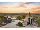 Relaxing patio with seating, fire pit, and water feature, mountain views at 17676 E Woolsey Way, Rio Verde, AZ 85263