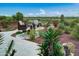 Landscaped patio with seating area, water feature, and desert views at 17676 E Woolsey Way, Rio Verde, AZ 85263