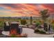 Desert landscape with mountain views, patio furniture, and water feature at 17676 E Woolsey Way, Rio Verde, AZ 85263