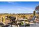 Backyard patio with fire pit and mountain views at 17676 E Woolsey Way, Rio Verde, AZ 85263