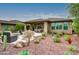 Landscaped backyard with desert plants and a patio area at 17676 E Woolsey Way, Rio Verde, AZ 85263