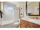 Bathroom with tub, shower, and wood vanity at 17676 E Woolsey Way, Rio Verde, AZ 85263