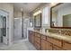 Double vanity bathroom with granite countertops and walk-in shower at 17676 E Woolsey Way, Rio Verde, AZ 85263