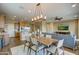 Open concept dining room with kitchen and living room views at 17676 E Woolsey Way, Rio Verde, AZ 85263