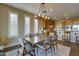 Bright dining room features a wood table and stylish light fixture at 17676 E Woolsey Way, Rio Verde, AZ 85263