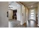 Elegant entryway with a barn door and built-in shelving at 17676 E Woolsey Way, Rio Verde, AZ 85263