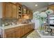 Modern kitchen with stainless steel appliances and light wood cabinets at 17676 E Woolsey Way, Rio Verde, AZ 85263