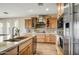 Modern kitchen with granite countertop and stainless steel appliances at 17676 E Woolsey Way, Rio Verde, AZ 85263