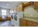 Laundry room with washer, dryer, and built-in cabinets at 17676 E Woolsey Way, Rio Verde, AZ 85263