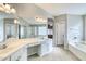 Elegant bathroom with double vanity, soaking tub and separate shower at 1872 E Shannon St, Chandler, AZ 85225