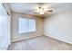 Well-lit bedroom featuring carpeted floors and a window with blinds at 1872 E Shannon St, Chandler, AZ 85225