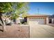 House exterior showcasing a two-car garage and manicured lawn at 1872 E Shannon St, Chandler, AZ 85225