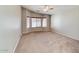 Spacious living room with carpeted floors and a ceiling fan at 1872 E Shannon St, Chandler, AZ 85225