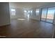 Spacious living room with tile flooring and sliding glass doors at 18950 W Stella Ave, Waddell, AZ 85355