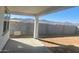 Covered patio overlooking a large backyard and mountain views at 18950 W Stella Ave, Waddell, AZ 85355