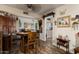 Charming dining area with wood table and chairs, offering an open view into the living room at 19019 N Camino Del Sol --, Sun City West, AZ 85375