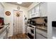 White appliances and granite counters highlight this updated kitchen area at 19019 N Camino Del Sol --, Sun City West, AZ 85375