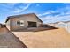 Spacious backyard with a covered patio, block wall and low maintenance desert landscaping at 19026 W Stella Ave, Waddell, AZ 85355