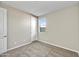 Comfortable bedroom with neutral paint, carpeted floors, window, and white doors at 19026 W Stella Ave, Waddell, AZ 85355