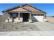 One-story home with a two-car garage and desert landscaping at 19026 W Stella Ave, Waddell, AZ 85355