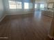 Bright living area with hardwood floors and large windows at 19026 W Stella Ave, Waddell, AZ 85355