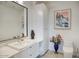 Modern bathroom with a sleek white vanity and large mirror at 200 W Portland St # 1312, Phoenix, AZ 85003