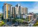 Modern building exterior with palm trees and urban setting at 200 W Portland St # 1312, Phoenix, AZ 85003