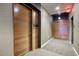 Modern hallway with wood doors and carpet flooring at 200 W Portland St # 1312, Phoenix, AZ 85003