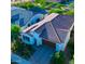 Aerial view of a single-story home featuring a terracotta roof, well-manicured landscaping, and an attached garage at 20363 W Coolidge St, Buckeye, AZ 85396