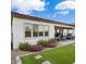 Home's exterior showcasing a backyard with artificial turf and a patio at 20363 W Coolidge St, Buckeye, AZ 85396