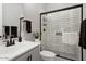 Bathroom with subway tile shower and gray vanity at 20363 W Coolidge St, Buckeye, AZ 85396