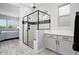 Modern bathroom with a glass shower, white subway tile, and grey cabinets at 20363 W Coolidge St, Buckeye, AZ 85396