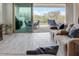 Living room with sliding glass doors opening to a patio and backyard at 20363 W Coolidge St, Buckeye, AZ 85396