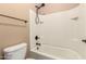 Bathroom with shower and tub, toilet and tile at 21525 E Camacho Rd, Queen Creek, AZ 85142