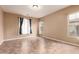 Bedroom with carpet and two windows with curtains at 21525 E Camacho Rd, Queen Creek, AZ 85142