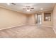 Bright bedroom with ceiling fan and plush carpeting at 21525 E Camacho Rd, Queen Creek, AZ 85142