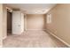 Bright bedroom featuring neutral walls and carpeted floors at 21525 E Camacho Rd, Queen Creek, AZ 85142