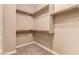 Large walk-in closet with hanging rods and shelves at 21525 E Camacho Rd, Queen Creek, AZ 85142