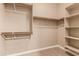 Spacious closet with ample shelving and hanging rods at 21525 E Camacho Rd, Queen Creek, AZ 85142