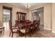 Formal dining room with a wood table and chairs, plus a built-in hutch at 21525 E Camacho Rd, Queen Creek, AZ 85142